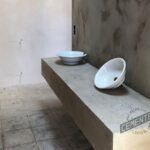 Washbasin covered with microcement base and where Cementec Consolidador epoxy primer has been applied.