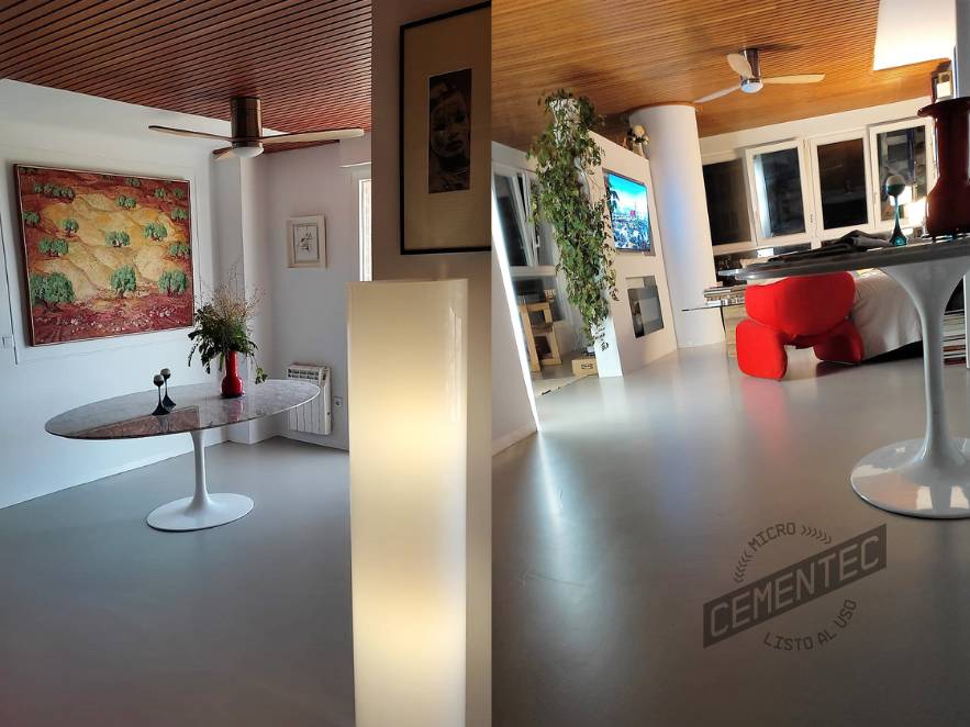 Part of living/dining room with ready-to-use High Transit microcement applied to the floor.